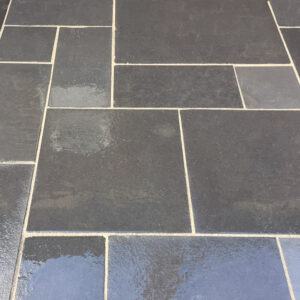 Black Natural Riven Limestone Patio Slabs - wet