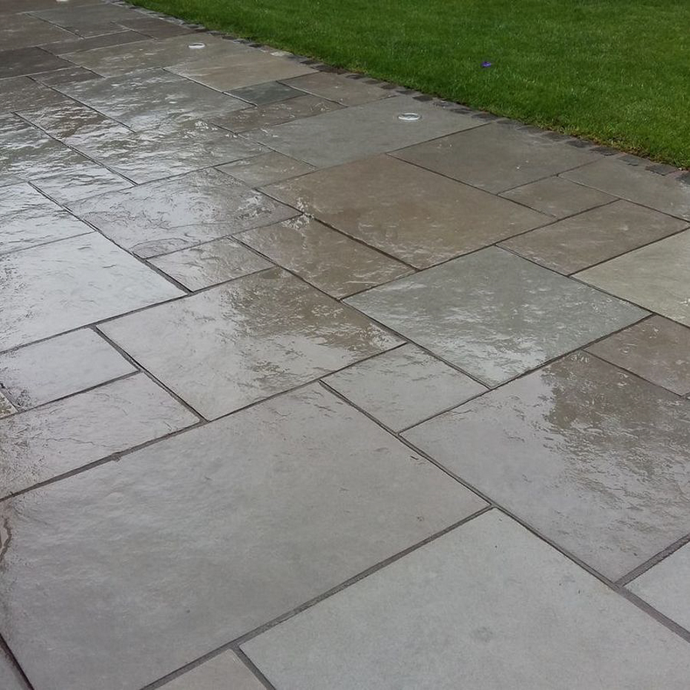 Grey Natural Riven Limestone Patio Slabs - wet