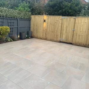 Canyon Sand 595x595 laid finished patio in a brick bond pattern