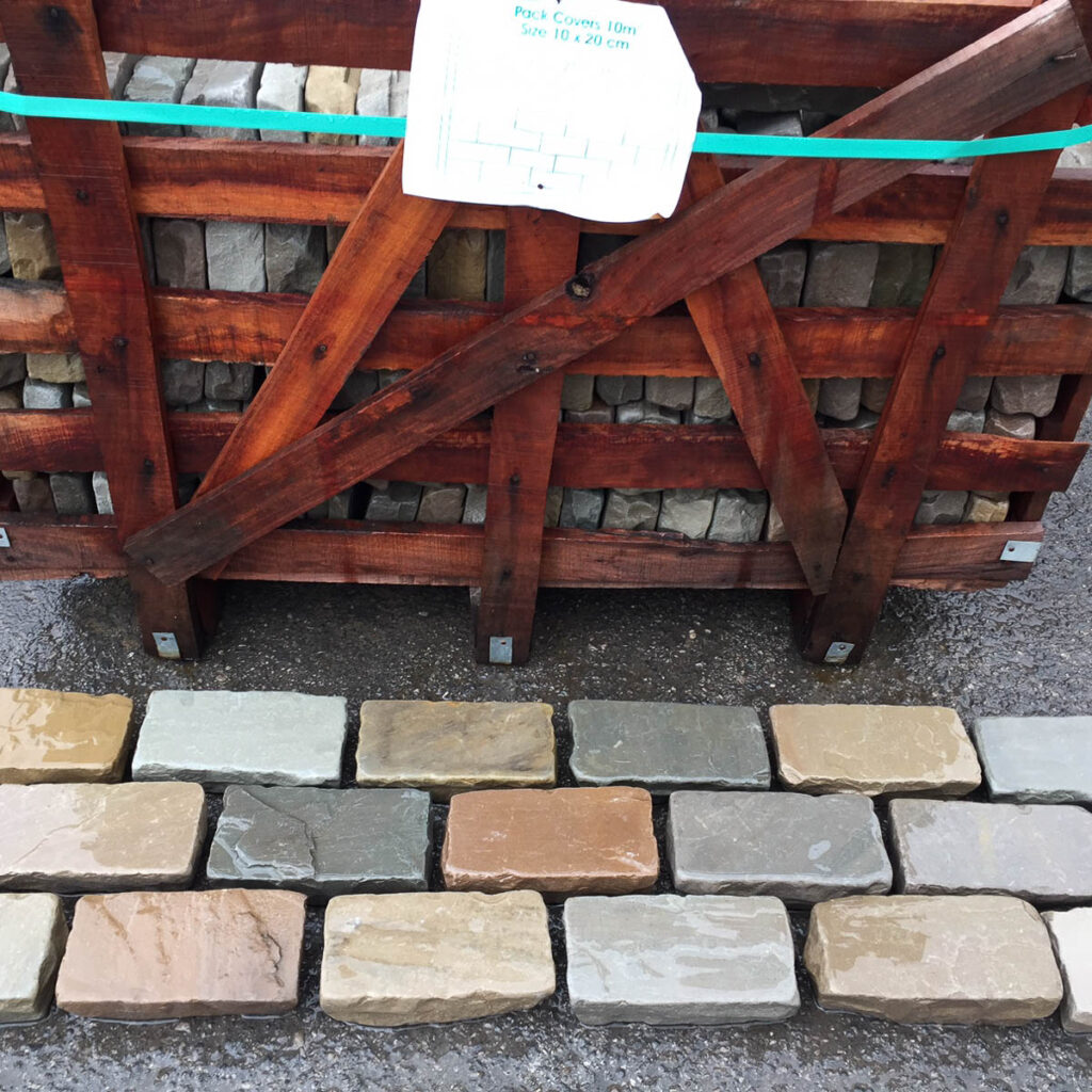 Raj Tumbled Cobbles 200x100 laid on the floor in a brick bond pattern